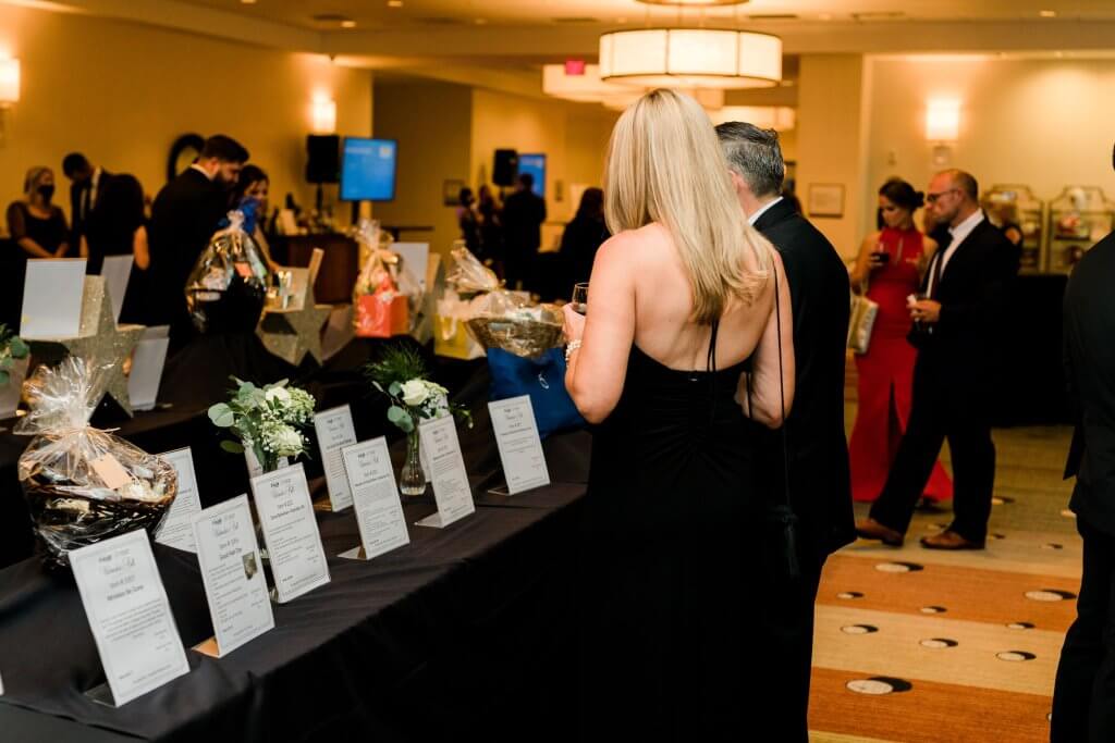 guests viewing silent auction items