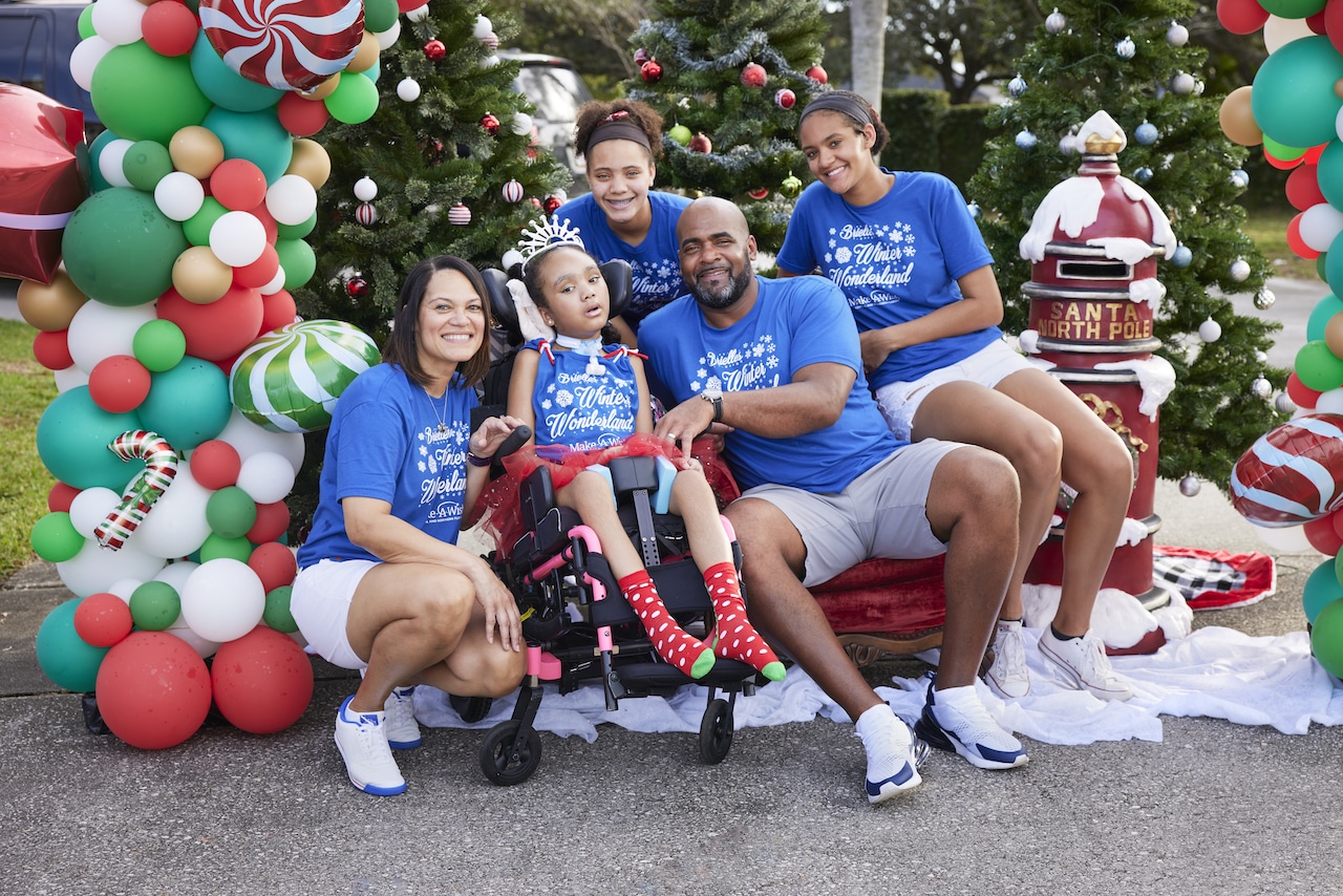 A Wish Family supporting their Wish Kid during their Winter Wonderland themed wish granted by Make-A-Wish of Central and Northern Florida