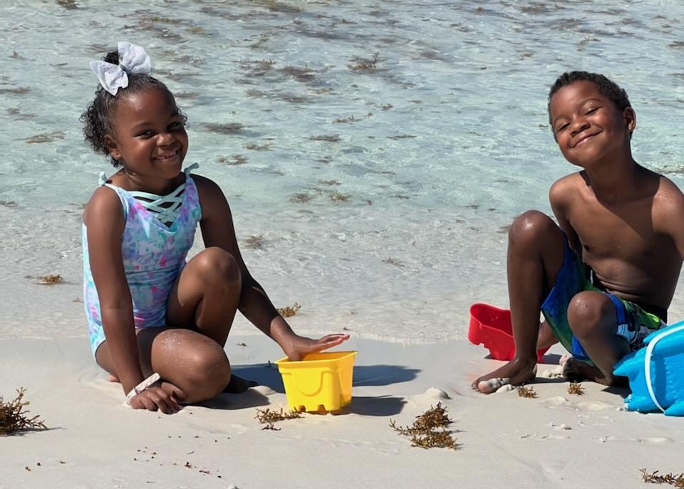 Wish Kid Imani playing on the beach with her brother