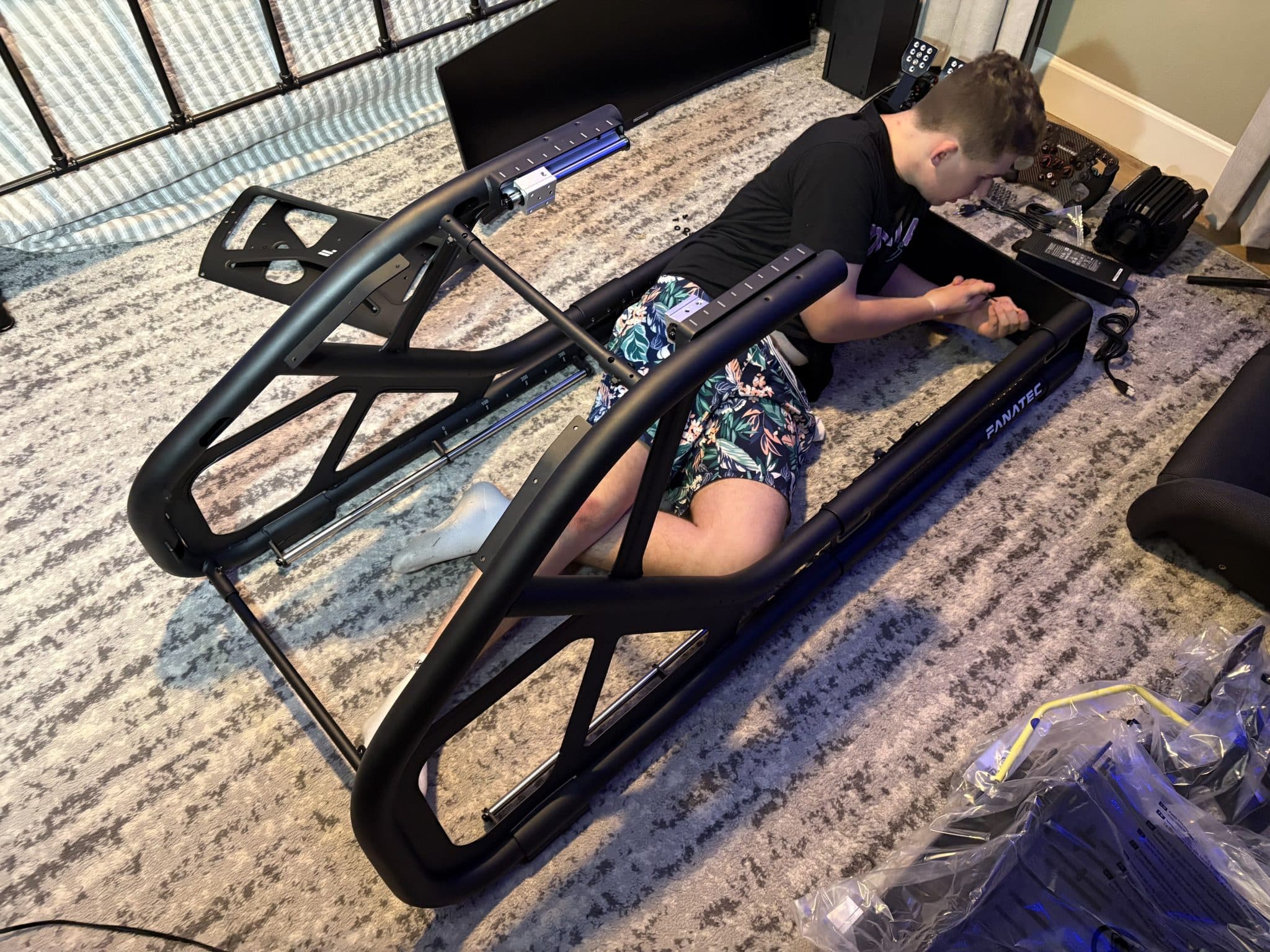 Ethan putting together his racing simulator